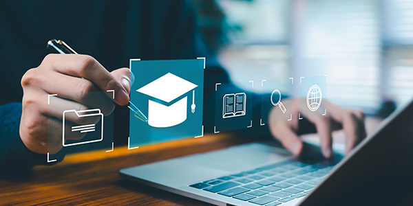 A person using a laptop and a stylus to interact with digital icons representing digital tools, including a graduation cap, a book, and a globe.